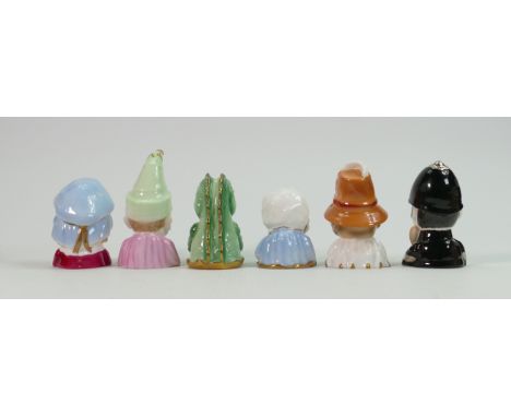 A collection of Royal Worcester candlesnuffers: Including Punch, Judy, Crocodile, Baby, Toby and Policeman. (6) 