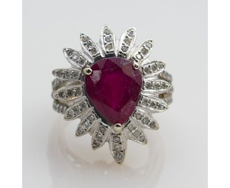 18ct white gold ruby &amp; diamond cluster: Large ring marked 18ct and tested as 18ct white gold, ring size L, weight 11.7g. 