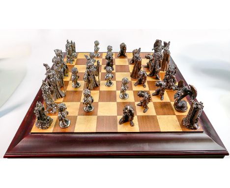 A very large Danbury Mint 'Lord of the Rings' pewter chess set &amp; board: Held in 2 drawers beneath the board, the largest 