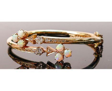 Yellow gold set opal &amp; diamond bangle: Set with 6 good coloured opals and 14 diamonds.  The 2 larger diamonds measuring a