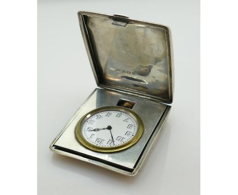 Silver cased folding desk or travelling clock Birmingham 1923: Weighs 131.9g gross, measures 70mm x 58mm x 15mm deep approx. 