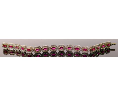 Magnificent 18ct gold ruby &amp; diamond bracelet: Set with 16 rubies and 240 bright diamonds.  Gross weight 20 grams.  Total