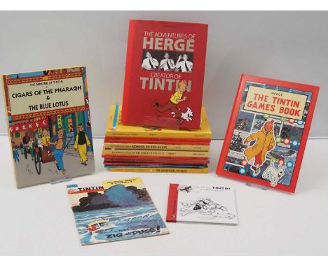 A mixed group of TINTIN / HERGE related books comprising:The Adventures of TINTIN At Sea; The Official Book of the national m