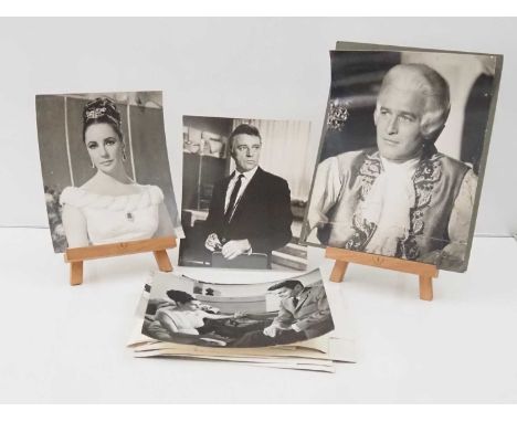 A group of original black/white stills and publicity stills featuring Elizabeth Taylor, Richard Burton, Robert Ryan, Nanette 
