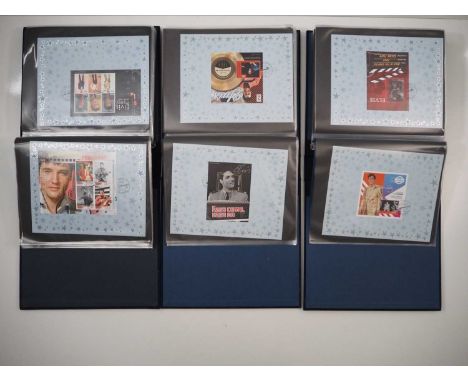 ELVIS PRESLEY- Three large Banham ring-file binders with “blue suede” effect covers, filled with Elvis Presley stamps from ar