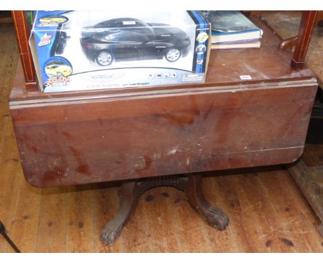 Regency mahogany Pembroke table on turned pedestal to four splayed paw legs