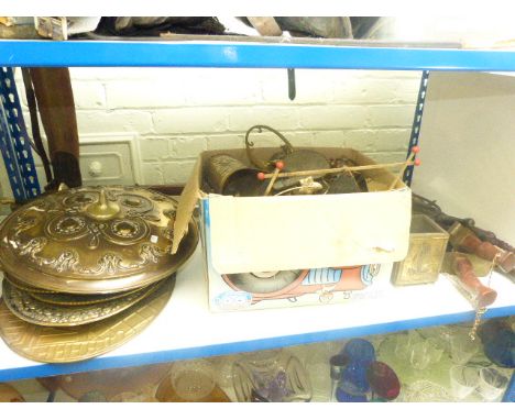 Brass shield and quantity of plaques, pistols, swords, axe, bellows and brassware