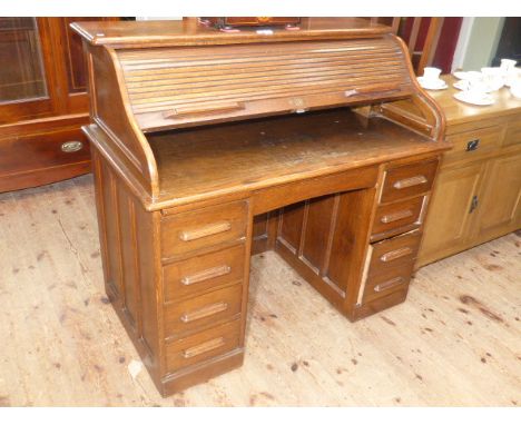 Oak S Shaped eight drawer double pedestal roll top desk