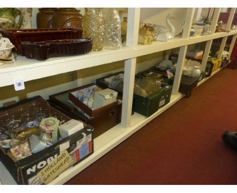 Full shelf of glass, china, ornaments, photograph frames, etc