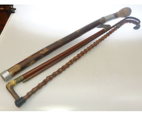 Silver mounted walking stick and two others and horn handled riding crop
