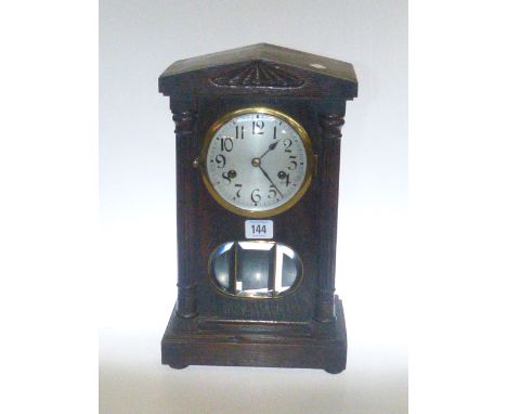 Oak arch top mantel clock with silvered dial