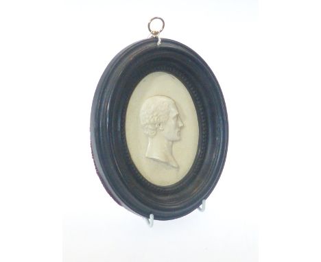 Georgian oval portrait plaque in ebony frame