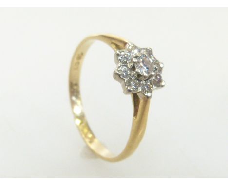 Nine stone diamond cluster ring set in 18ct yellow gold, size K