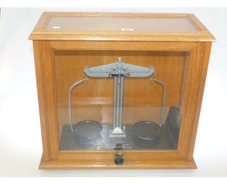 Goodbrand & Co Ltd balance scales and weights in glazed case