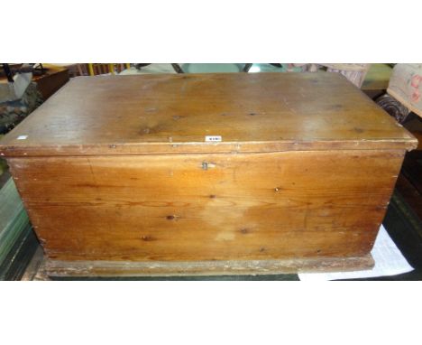 A 19th century pine lift top trunk.