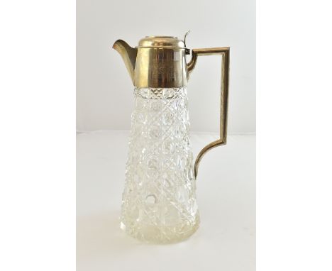 A silver mounted hobnail cut glass claret jug, with an angular tubular handle, by William Hutton and sons, Birmingham 1903.  