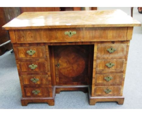 A 17th century oyster veneered kingwood and rosewood banded bureau table, the hinged top revealing a fitted welled interior o