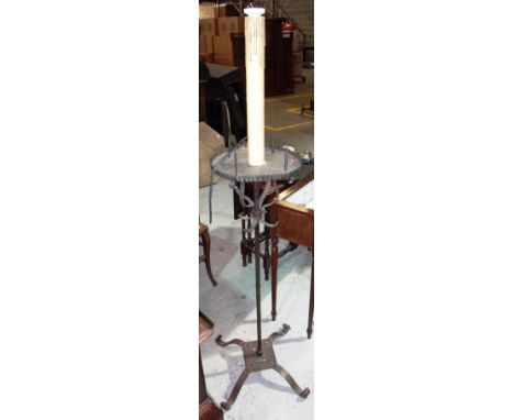 A large wrought iron candle stand/lamp.