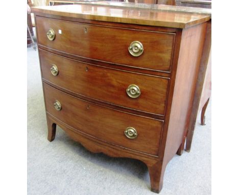 A Regency mahogany bowfront chest of three long graduated drawers on splayed bracket feet, 88cm wide. 