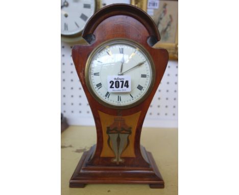 A mahogany cased Art Nouveau mantel clock of pinched waist form, parquetry inlaid with copper, brass and coloured woods, with