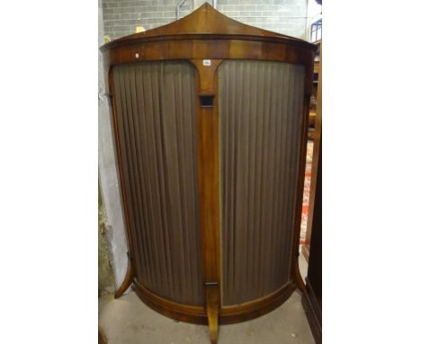 A Continental walnut curved dressing screen with sliding door.