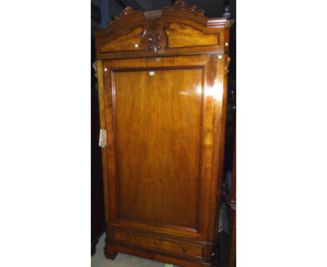 A 20th century walnut single door wardrobe.