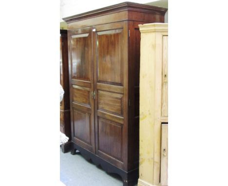 A George III mahogany Jersey hanging cupboard, with pair of six panel doors on splayed bracket feet, 138cm wide x 202cm high.