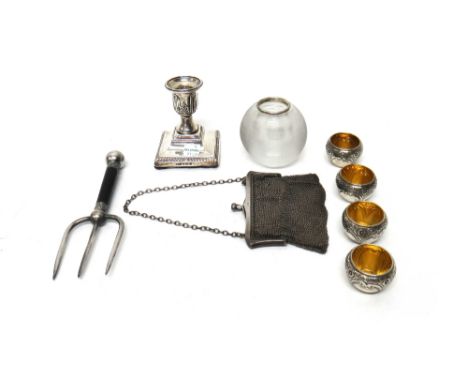 A set of four Victorian silver salts, with embossed decoration, Sheffield 1890, a glass match striking stand, one silver cand