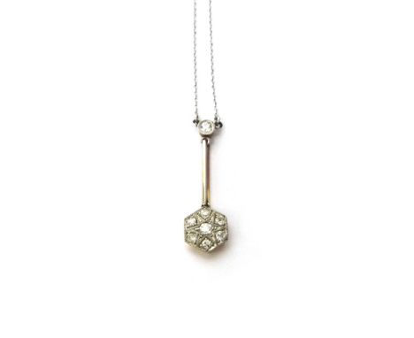 A diamond set pendant necklace, the hexagonal drop mounted with the principal circular cut diamond at the centre, in a surrou