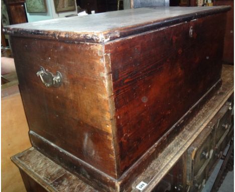 A 19th century stained pine lift top trunk.