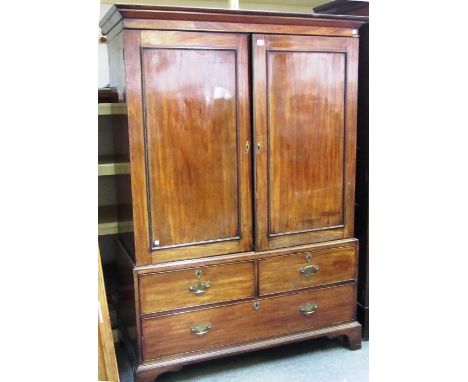 A George III mahogany linen press, the pair of panel doors over two short and three long drawers, on bracket feet, 130cm wide