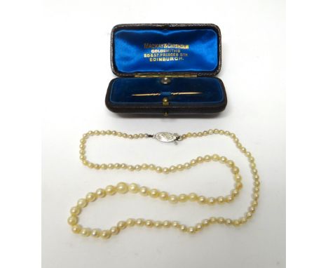 A single row necklace of graduated cultured pearls, on a Sterling silver oval clasp and a half pearl set gold dress stud with