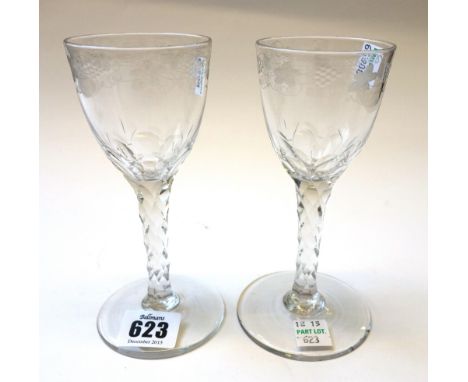 Two English wine glasses, circa 1780 or later, each ogee bowl with etched fruiting vine decoration over a facet cut stem and 