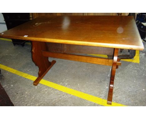 An Ercol dining table together with six dining chairs.