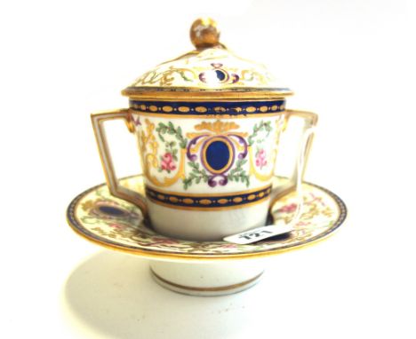 A Sevres style porcelain chocolate cup, cover and stand, 19th century, with gilt fruit finial over a tapering two handled cup