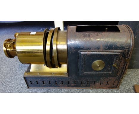 A Victorian magic lantern projector 'The Optimus' by Perken, Son and Co and a quantity of 3 1/4 inch glass slides, sets and a