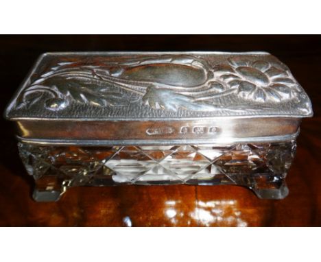 A cut glass rectangular trinket box with embossed silver cover, Birmingham 1904 by William Henry Sparrow, the cover embossed 