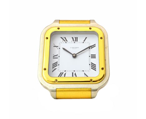 A gilt metal and steel cased square cased Cartier Pairs Quartz alarm clock, fitted with a strut to the back, the signed white