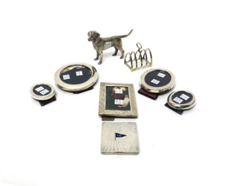 Four silver mounted photograph frames, a foreign rectangular photograph frame with feathered scroll engraved decoration, deta