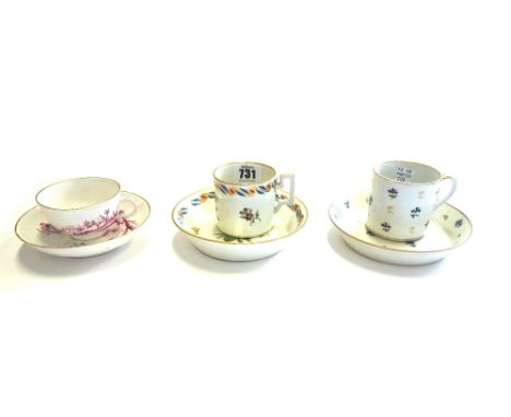 Two 18th century Vienna porcelain cabinet cups and saucers decorated with gilt flowers and a Hochst 18th century cup and sauc