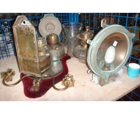 A quantity of copper and brass lights and fittings, including a girandole, a pothole light, candlesticks and sundry.