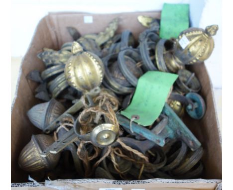 A quantity of gilt metal Victorian style curtain rings, pole finials and tie-backs, each with foliate cast decoration, (a.f),