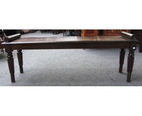 A Victorian oak hall bench, with turned end stops on tapering octagonal supports, 137cm wide.