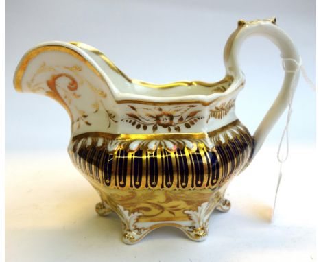 A Ridgway porcelain part tea and coffee service, circa 1825-30, gilt with a leaf design against a  deep cream ground inside b