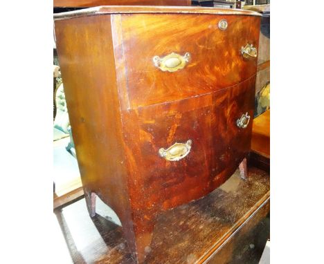 A 19th century mahogany bowfront commode.