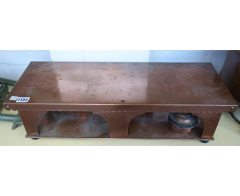 An Edwardian copper warming plate with three oil burners to the undertier and one larger copper warming cabinet, the first 61