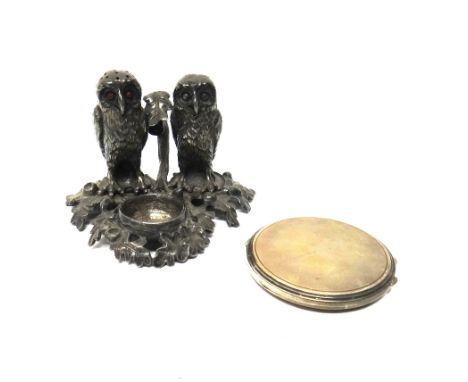 A silver circular powder compact, the exterior engine turned, fitted with a mirror within and a Victorian plated novelty cond