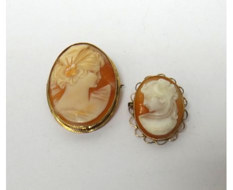 A 9ct gold mounted oval shell cameo brooch, carved as the portrait of a lady and a smaller 9ct gold mounted oval shell cameo 