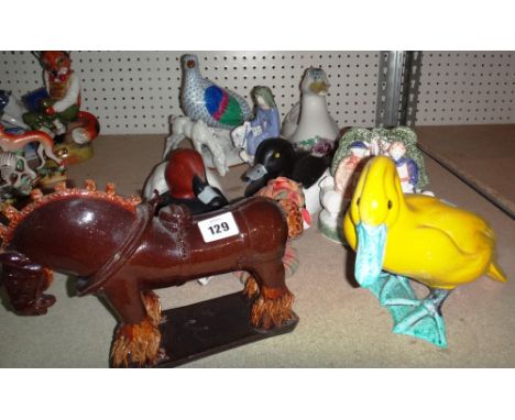 A quantity of ceramic and wooden models, mainly ducks, including a Herend pigeon.