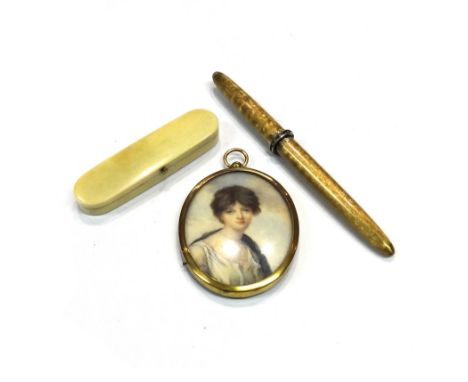 An ivory hinge lidded toothpick case, of curved rectangular form, fitted with a mirror within (damaged), the cover mounted wi